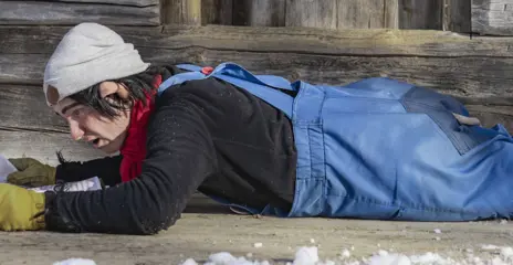 Trolle is sitting on the terrace outside Trollgården reading the newspaper.
