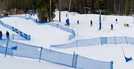 Hit N' Turn competition where snowboarders compete in Banked-slalom, a winding journey through Ormtungan
