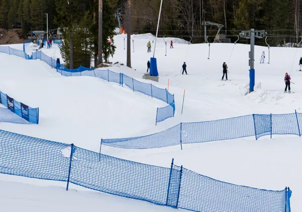 Hit N' Turn competition where snowboarders compete in Banked-slalom, a winding journey through Ormtungan