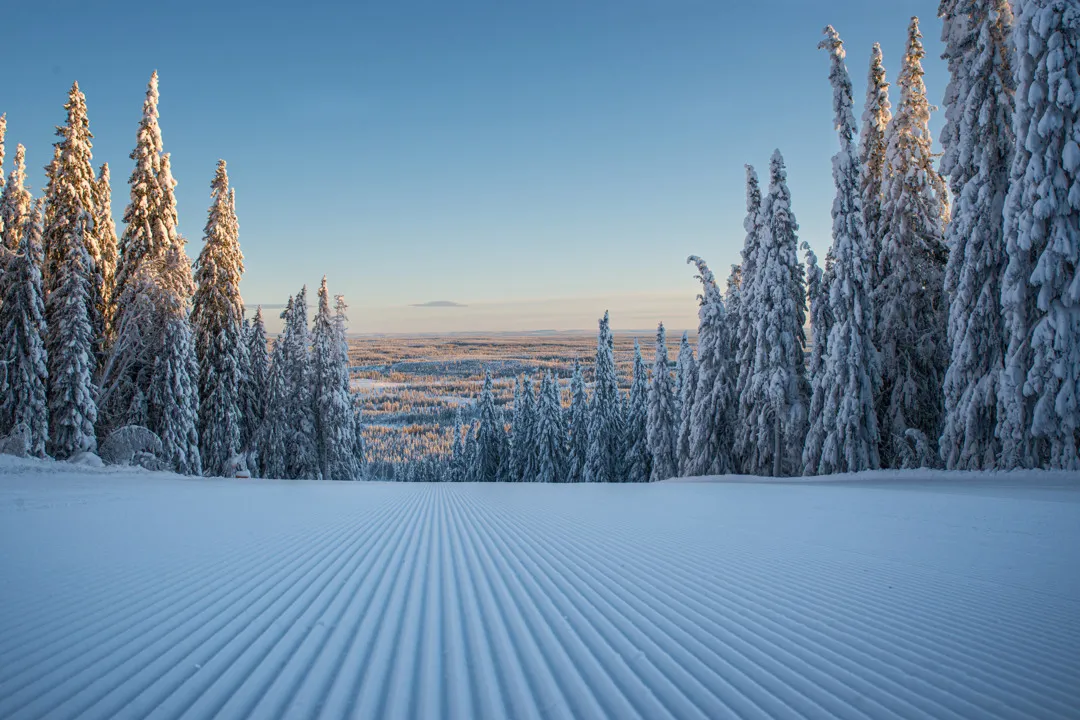 a picture of a ski slope with perfectly groomed corduroy