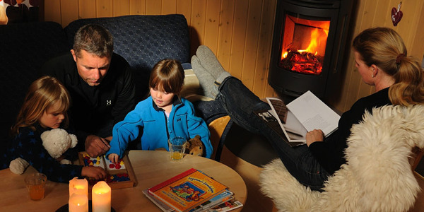Family cosiness by an open fire